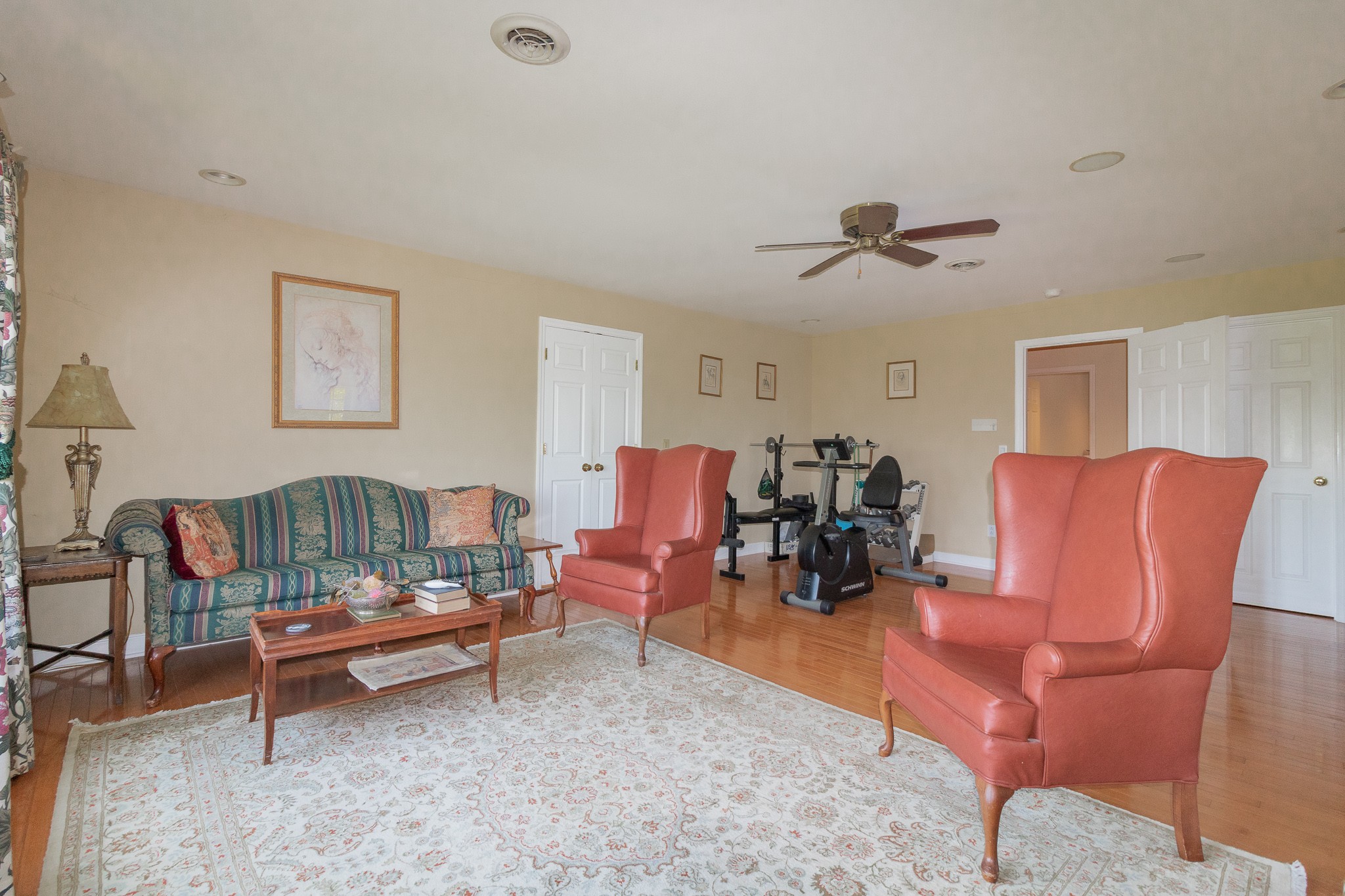 2654 Henry Gower Road Pleasant View, TN 37146 - Photo 31 of 49 a living room with furniture a rug and a ceiling fan