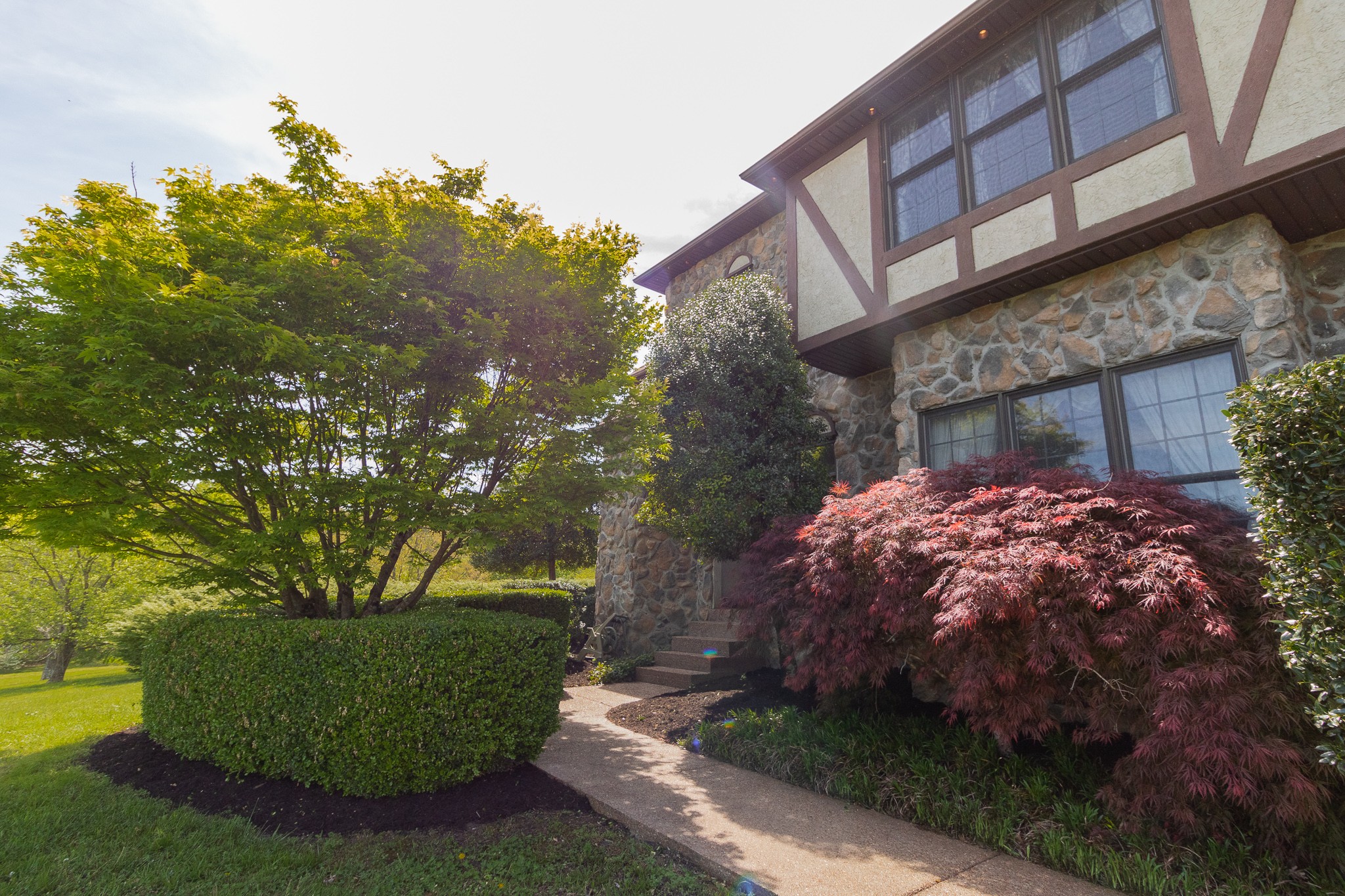 2654 Henry Gower Road Pleasant View, TN 37146 - Photo 5 of 49 a front view of a house with garden