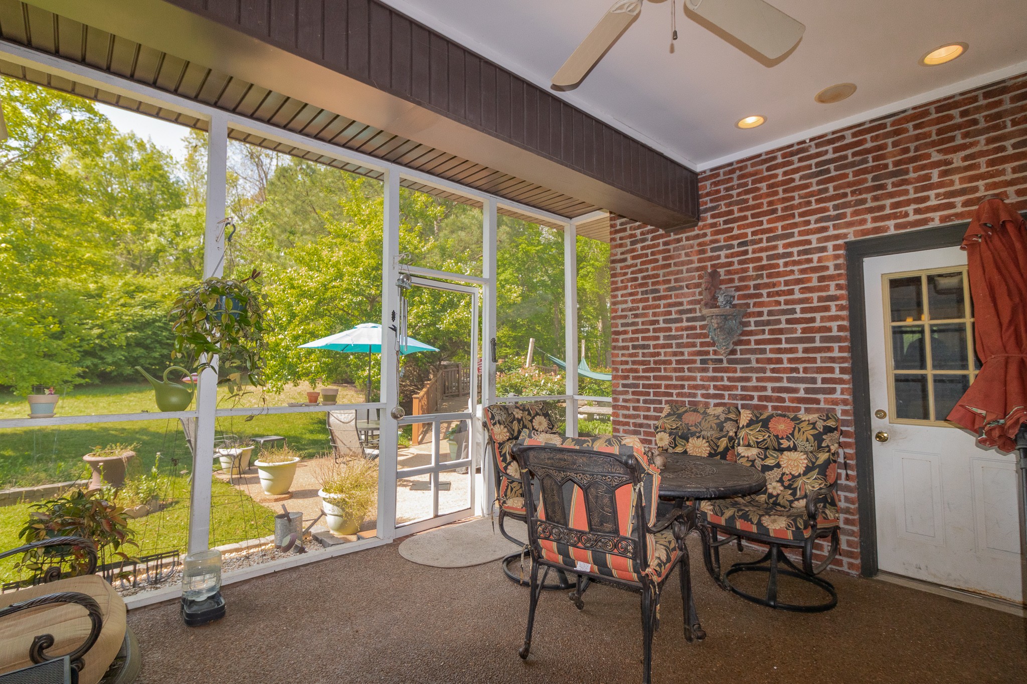 2654 Henry Gower Road Pleasant View, TN 37146 - Photo 41 of 49 a view of a porch with chairs and backyard