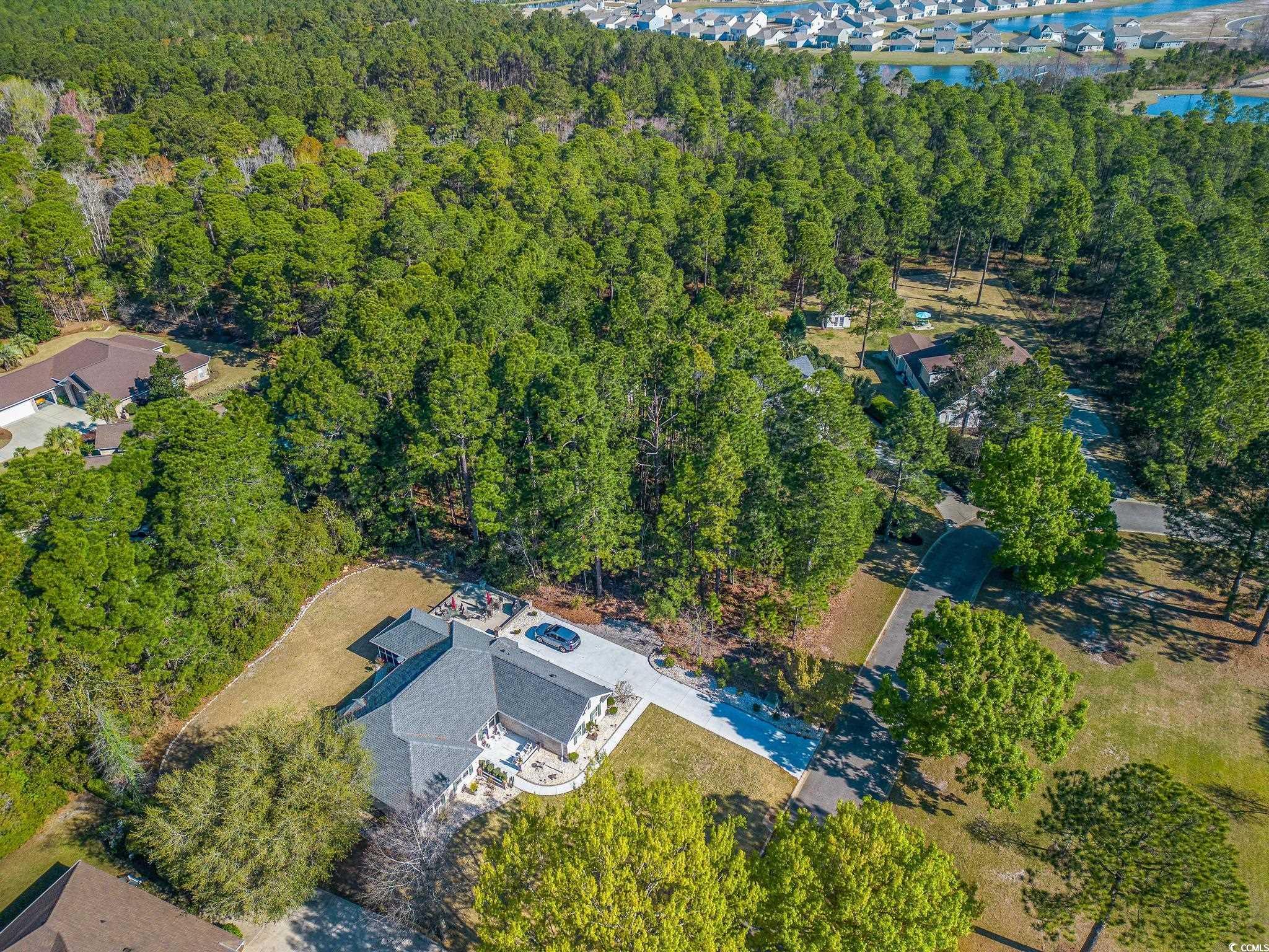 4374 Winged Foot Court Myrtle Beach, SC 29579 - Photo 9 of 25 View of property location with a heavily wooded area