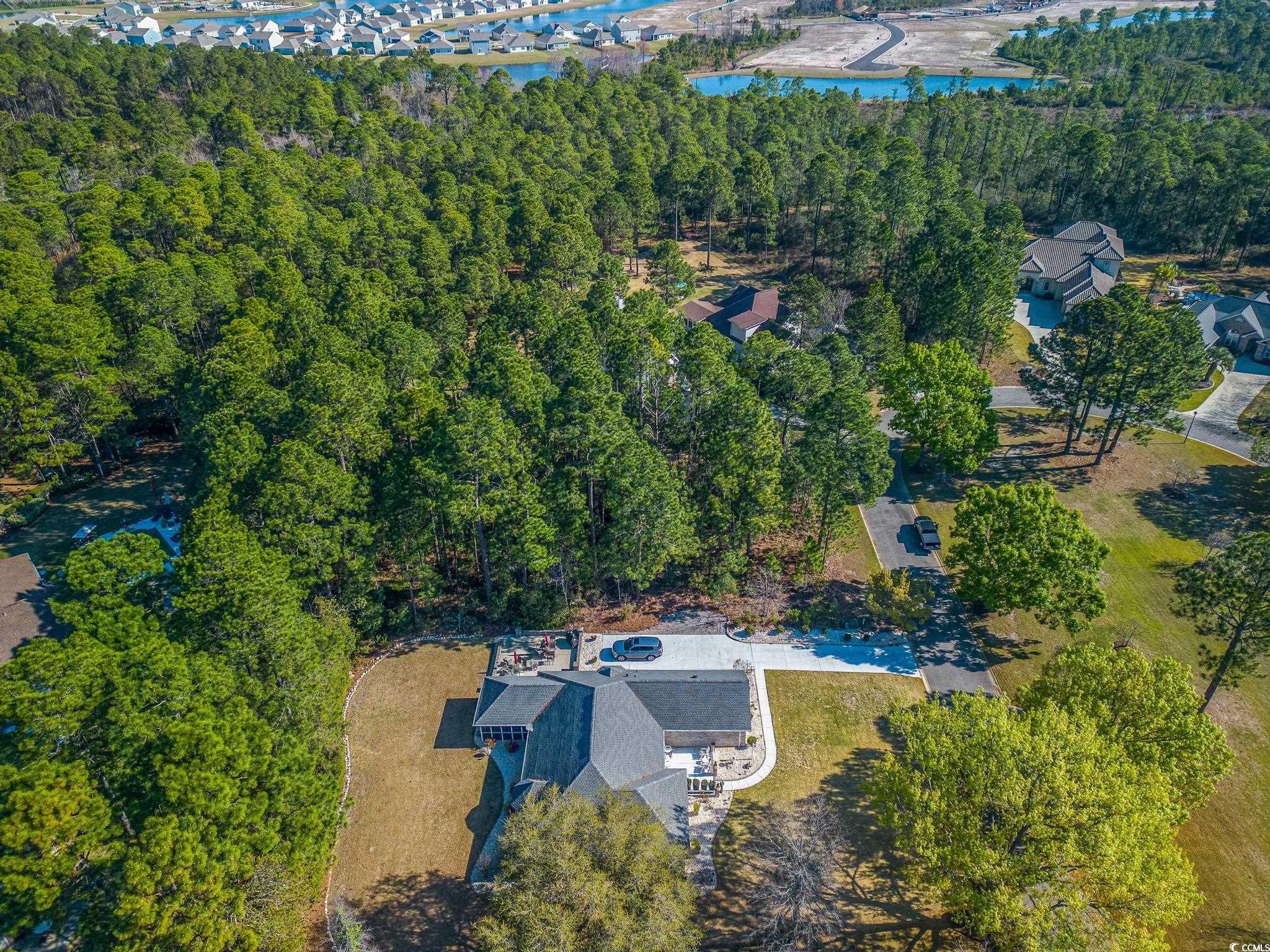 4374 Winged Foot Court Myrtle Beach, SC 29579 - Photo 10 of 25 View of property location featuring a nearby body of water and a forest