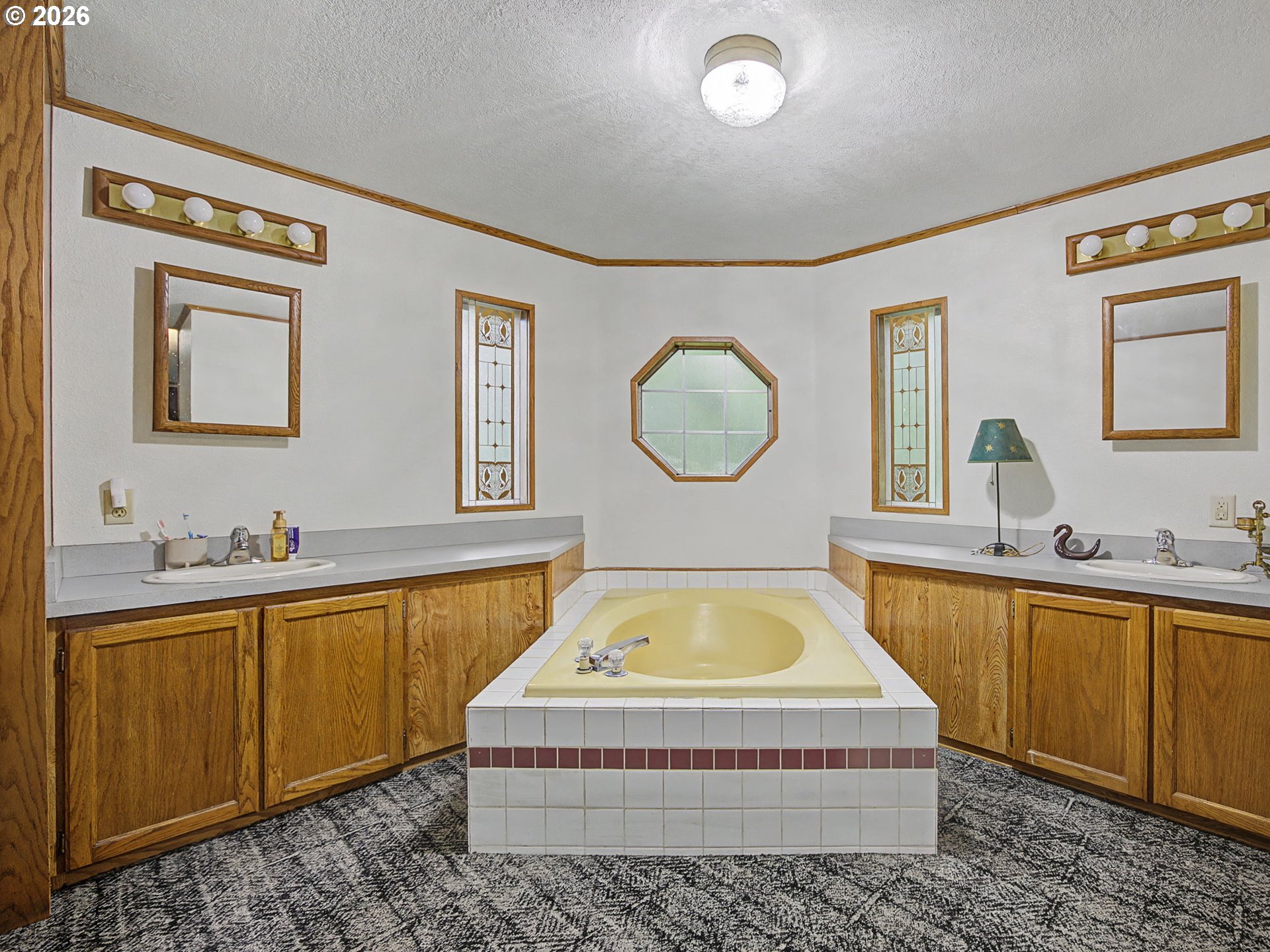 41180 Southeast Kubitz Road Sandy, OR 97055 - Photo 18 of 35 a spacious bathroom with a tub double vanity sink and a mirror