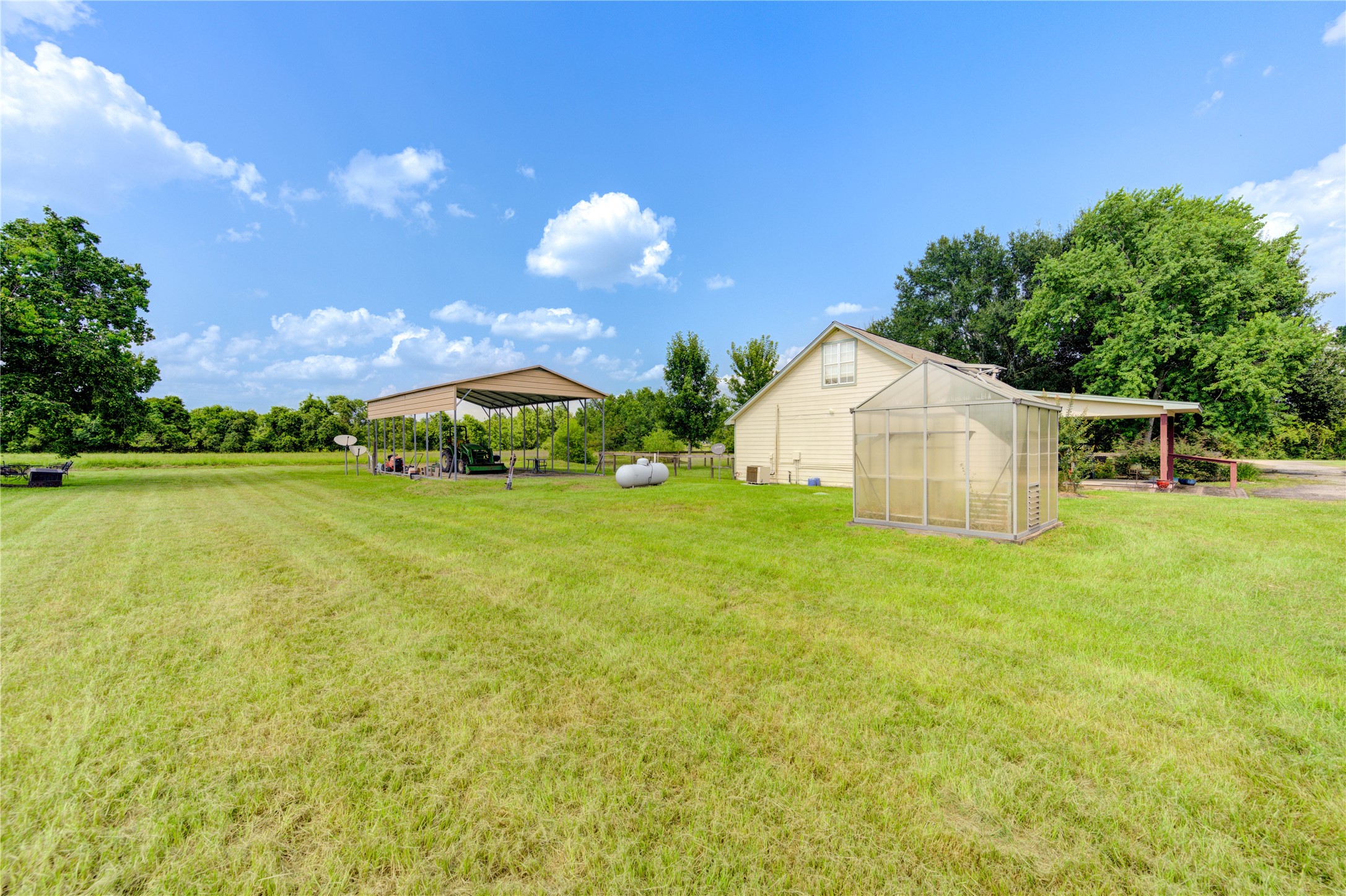 922 Agg Road Tomball, TX 77375 - Photo 11 of 15 a view of a house with a yard and garage