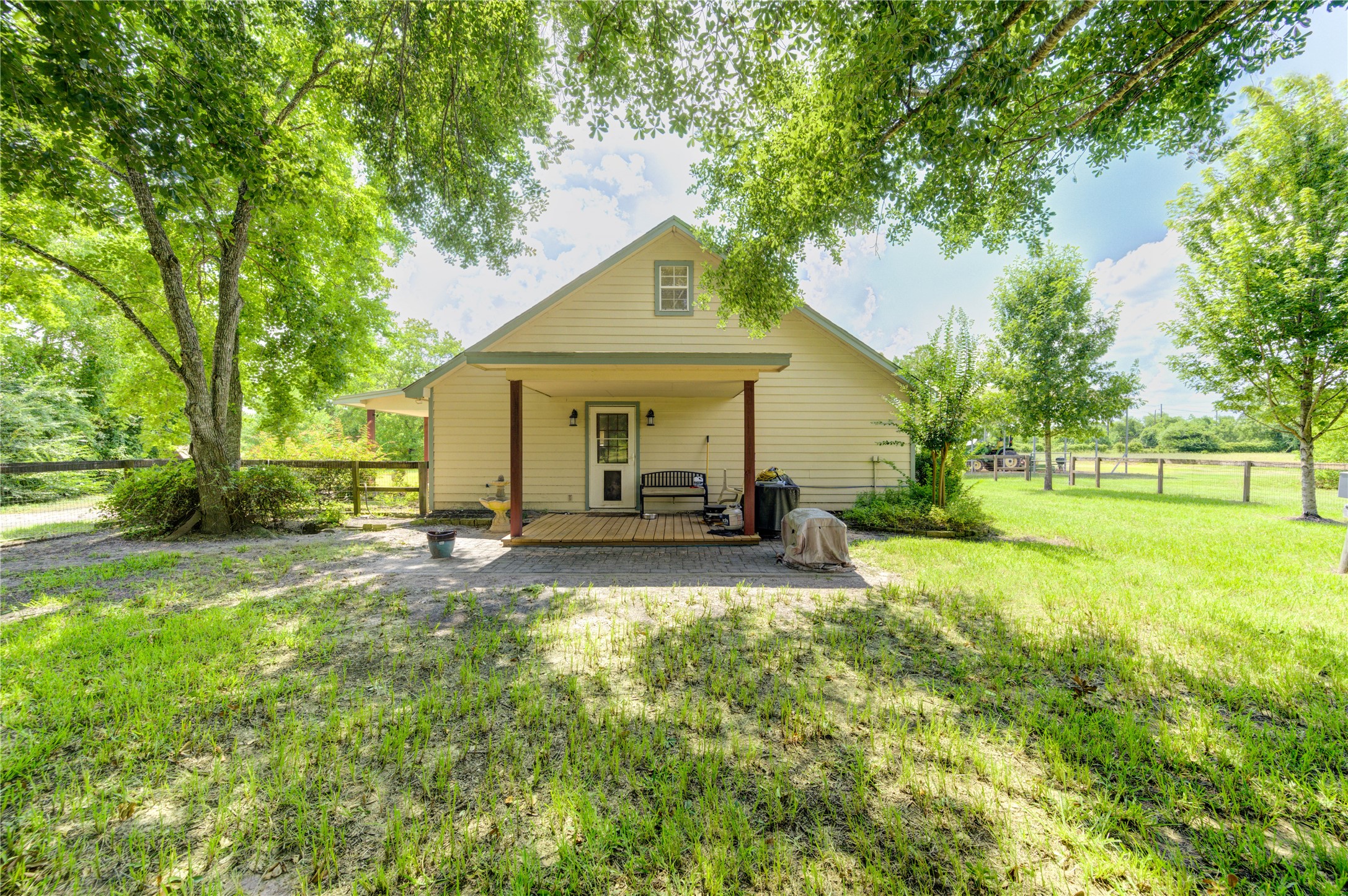 922 Agg Road Tomball, TX 77375 - Photo 5 of 15 a front view of a house with yard and green space