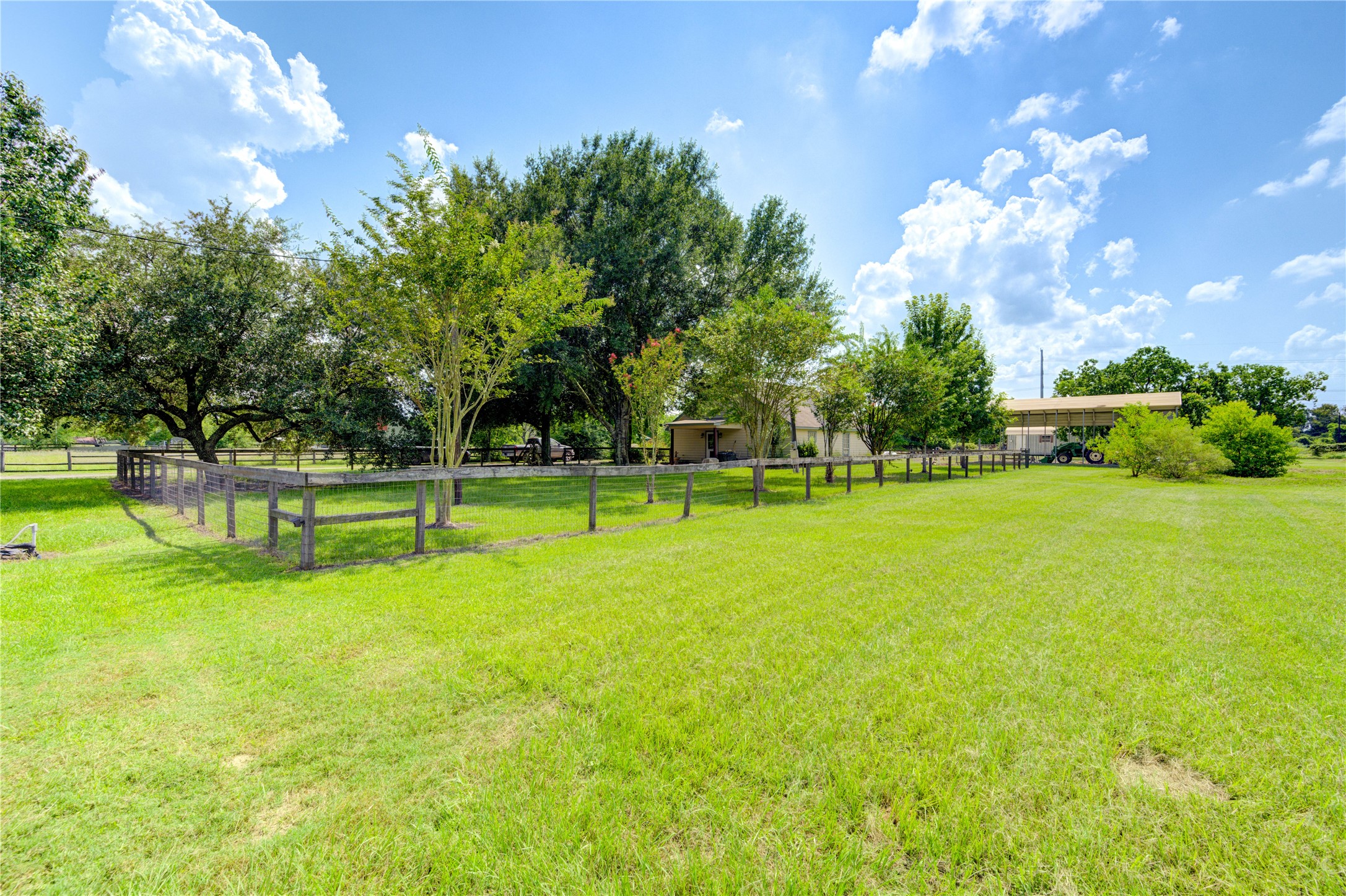 922 Agg Road Tomball, TX 77375 - Photo 8 of 15 a view of a golf course with a lake