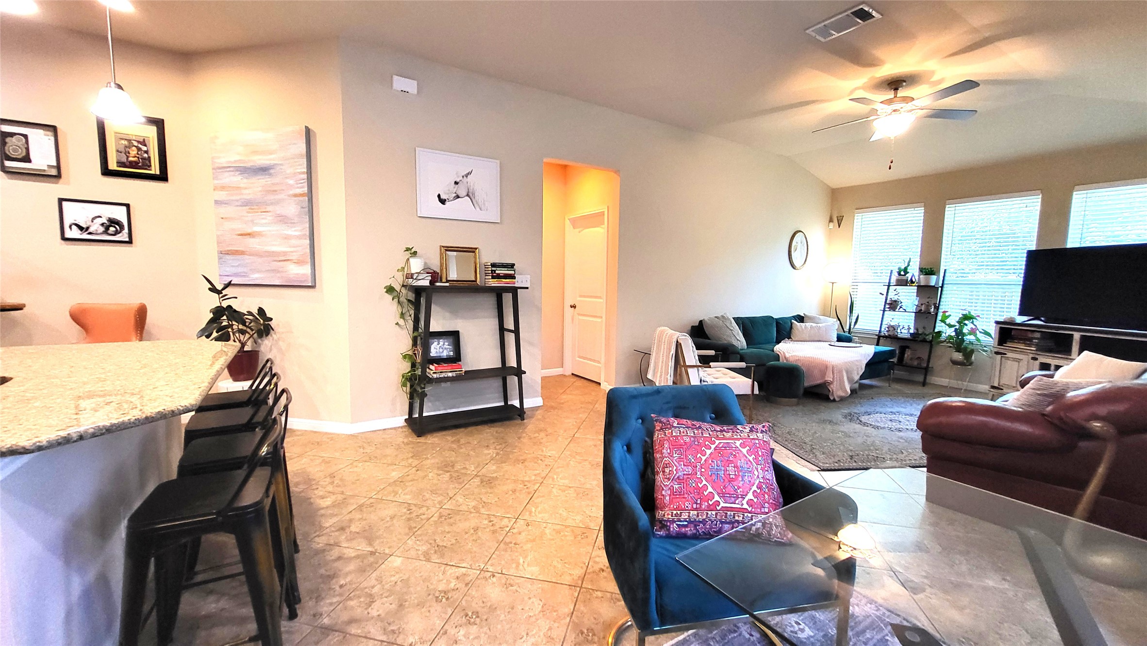 413 Anacua Loop, Unit 8 Manchaca, TX 78652 - Photo 23 of 23 An open floorplan connects the casual dining area and kitchen to the airy living room.