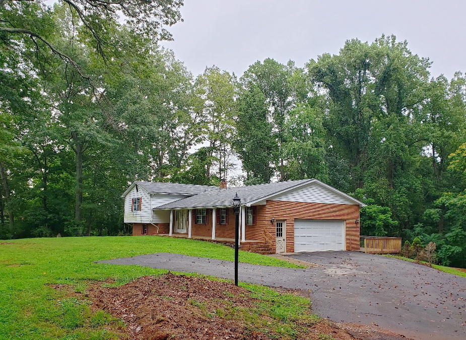 110 Lakeshore Terrace Road Hardy, VA 24101 - Photo 2 of 21 a front view of a house with a garden