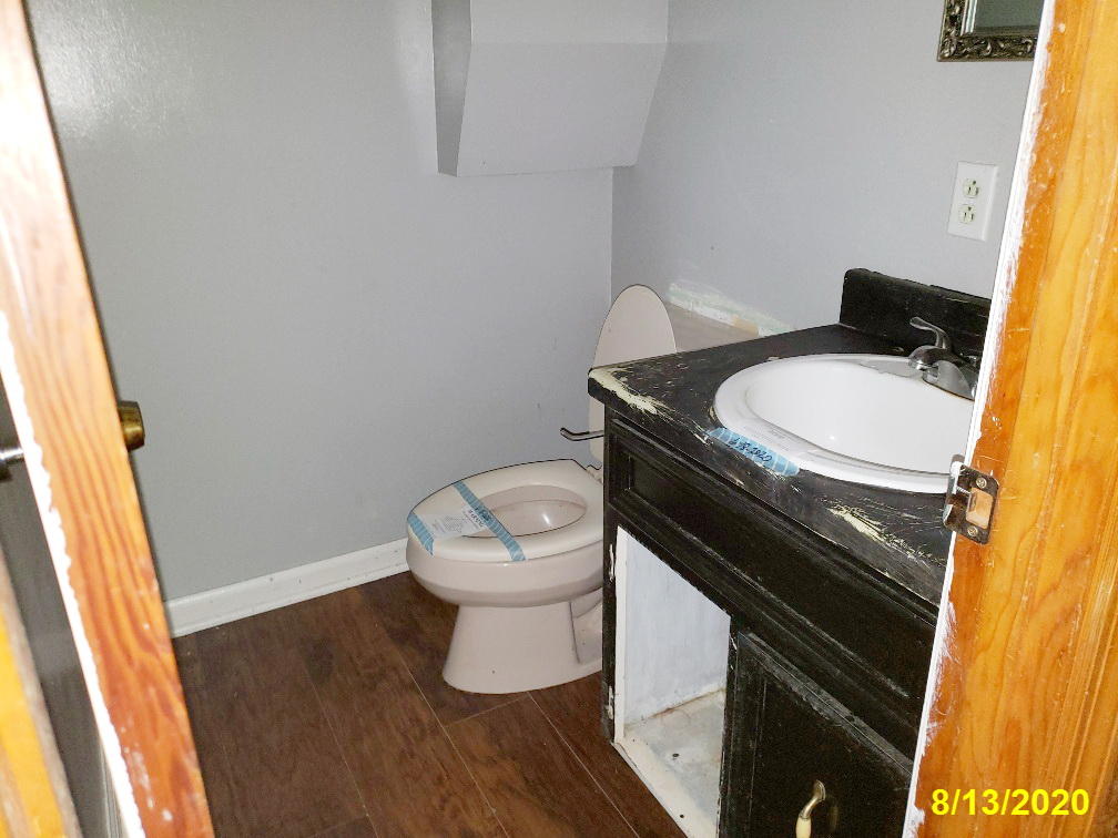 110 Lakeshore Terrace Road Hardy, VA 24101 - Photo 18 of 21 a bathroom with a granite countertop toilet and a sink
