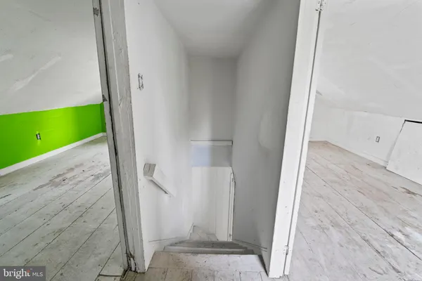 a view of an entryway with wooden floor