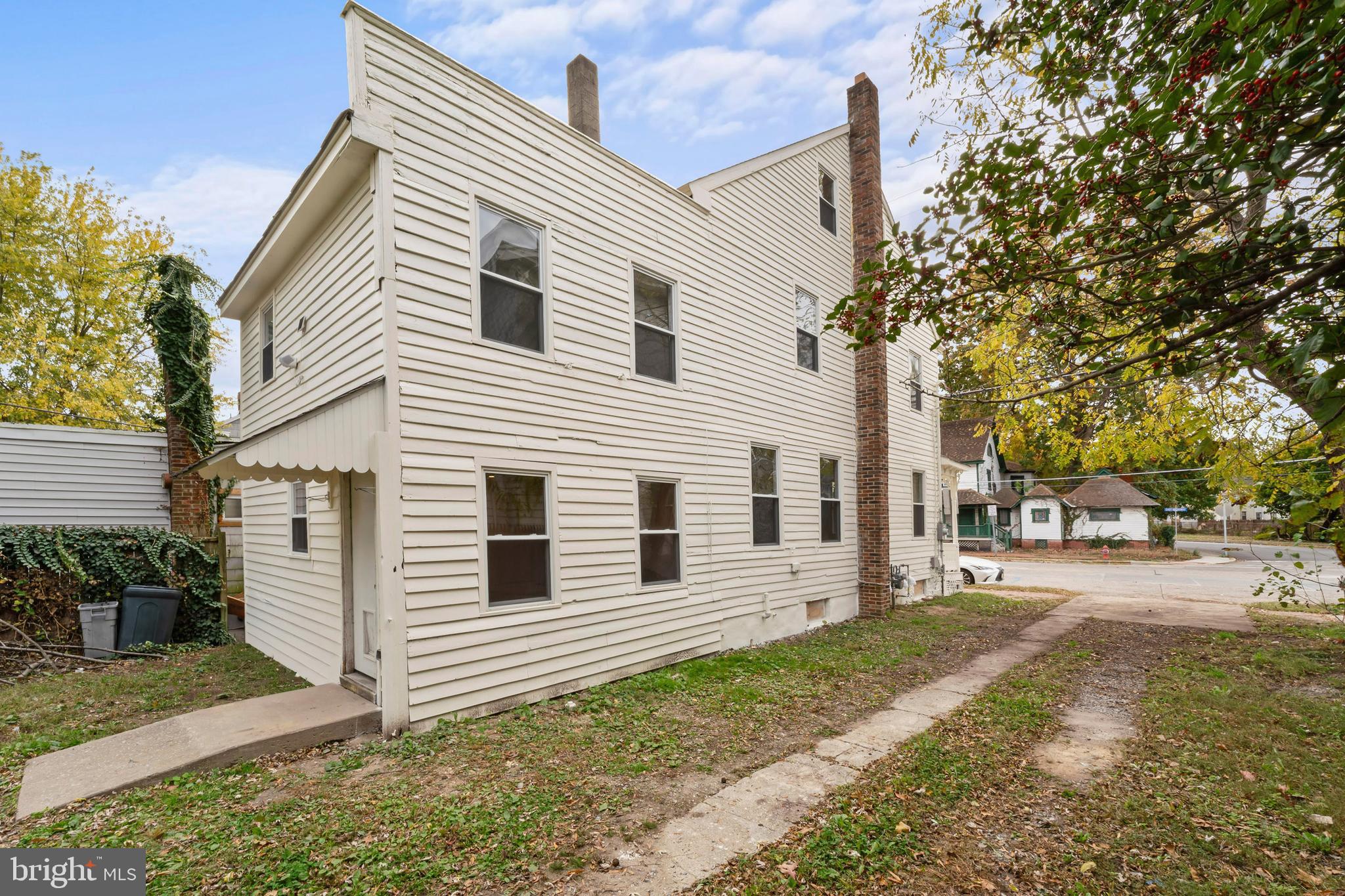 264 East Broadway Salem, NJ 08079 - Photo 46 of 51 a view of a white house with a large space in front of it