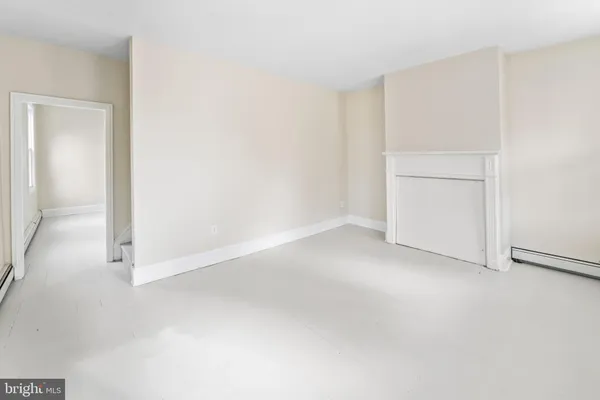 wooden floor chandelier and windows in a room