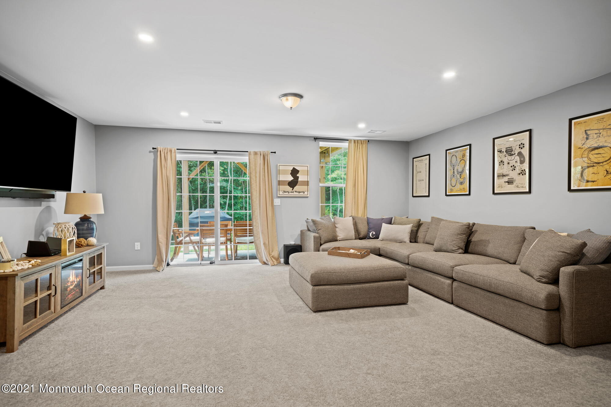 114 Revival Road Brick, NJ 08723 - Photo 8 of 44 a living room with furniture and a flat screen tv