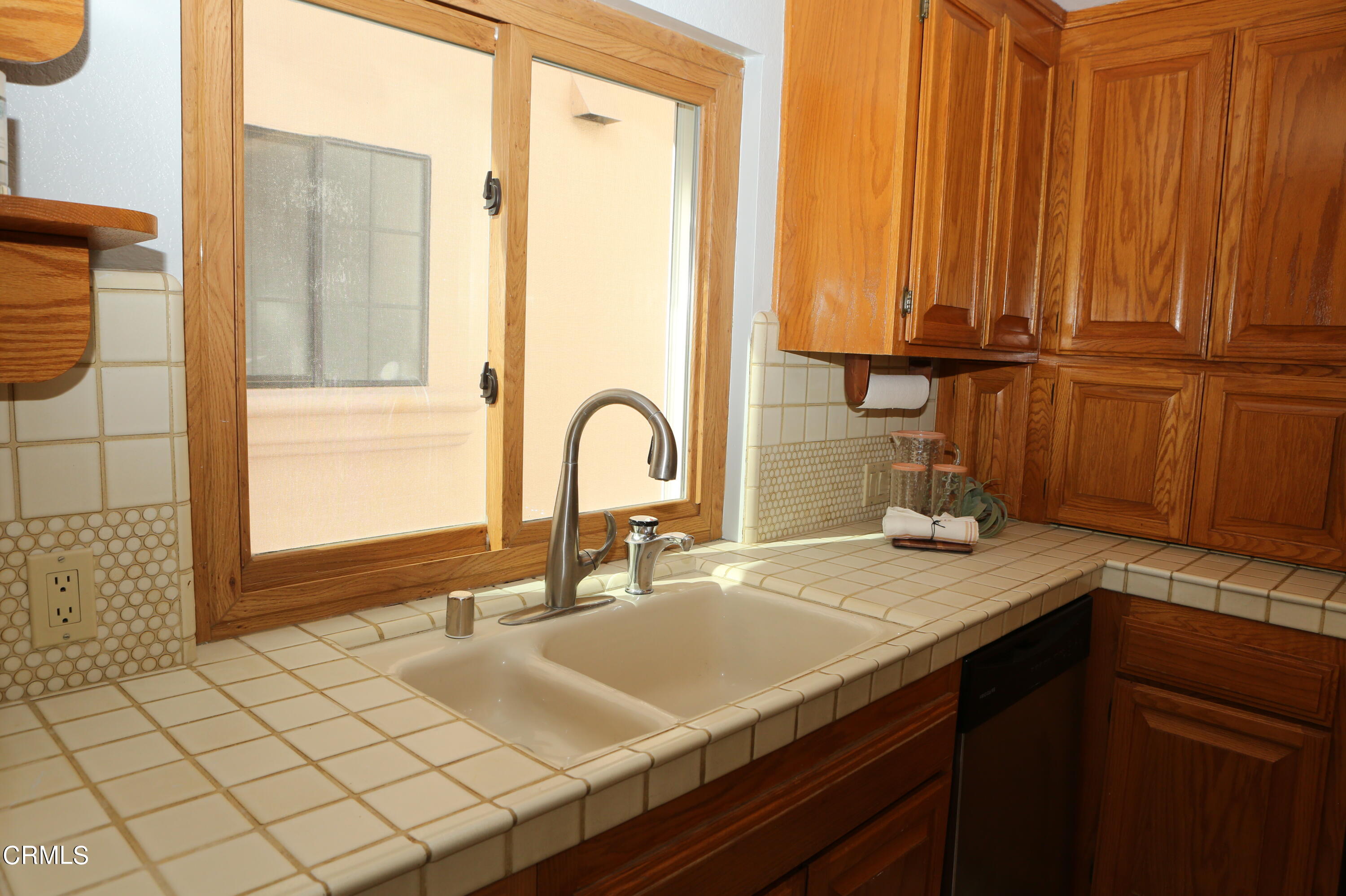 3446 Ocean Drive Oxnard, CA 93035 - Photo 16 of 37 a bathroom with a sink and a mirror