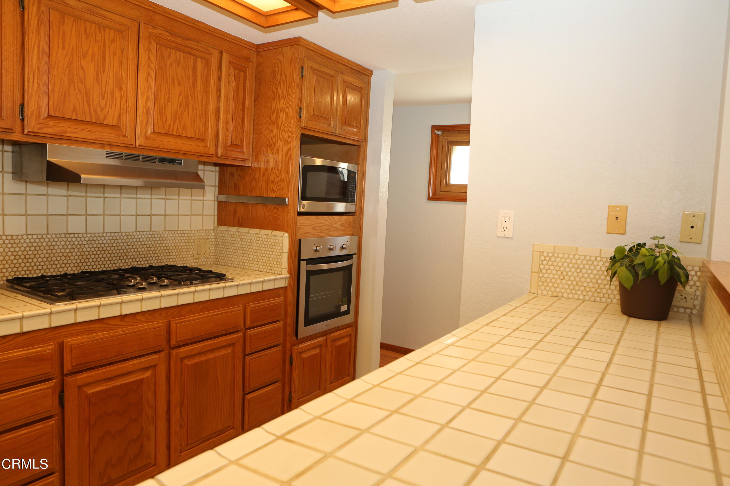 3446 Ocean Drive Oxnard, CA 93035 - Photo 17 of 37 a kitchen with a stove and cabinets