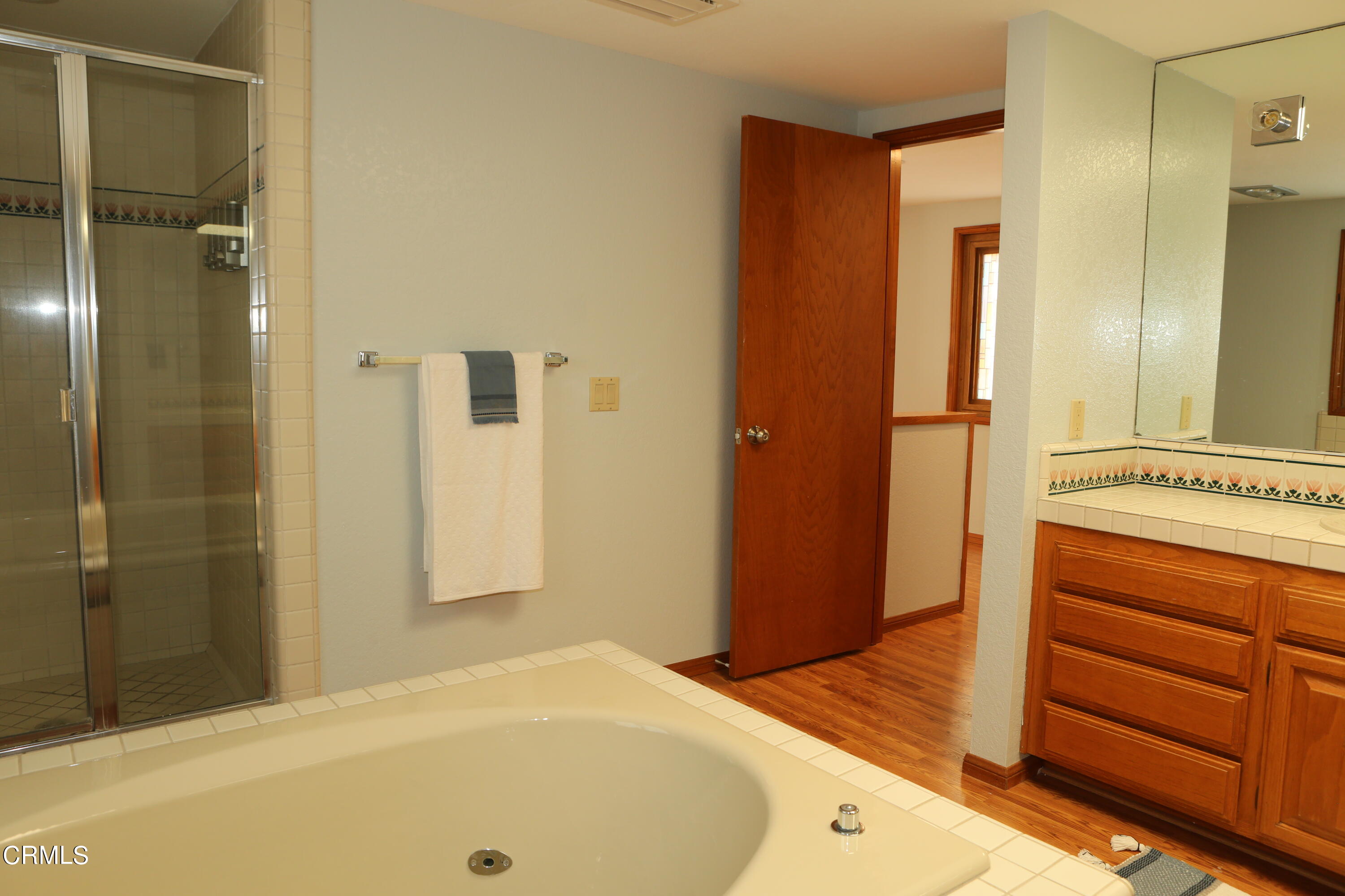 3446 Ocean Drive Oxnard, CA 93035 - Photo 18 of 37 a bathroom with a tub and shower