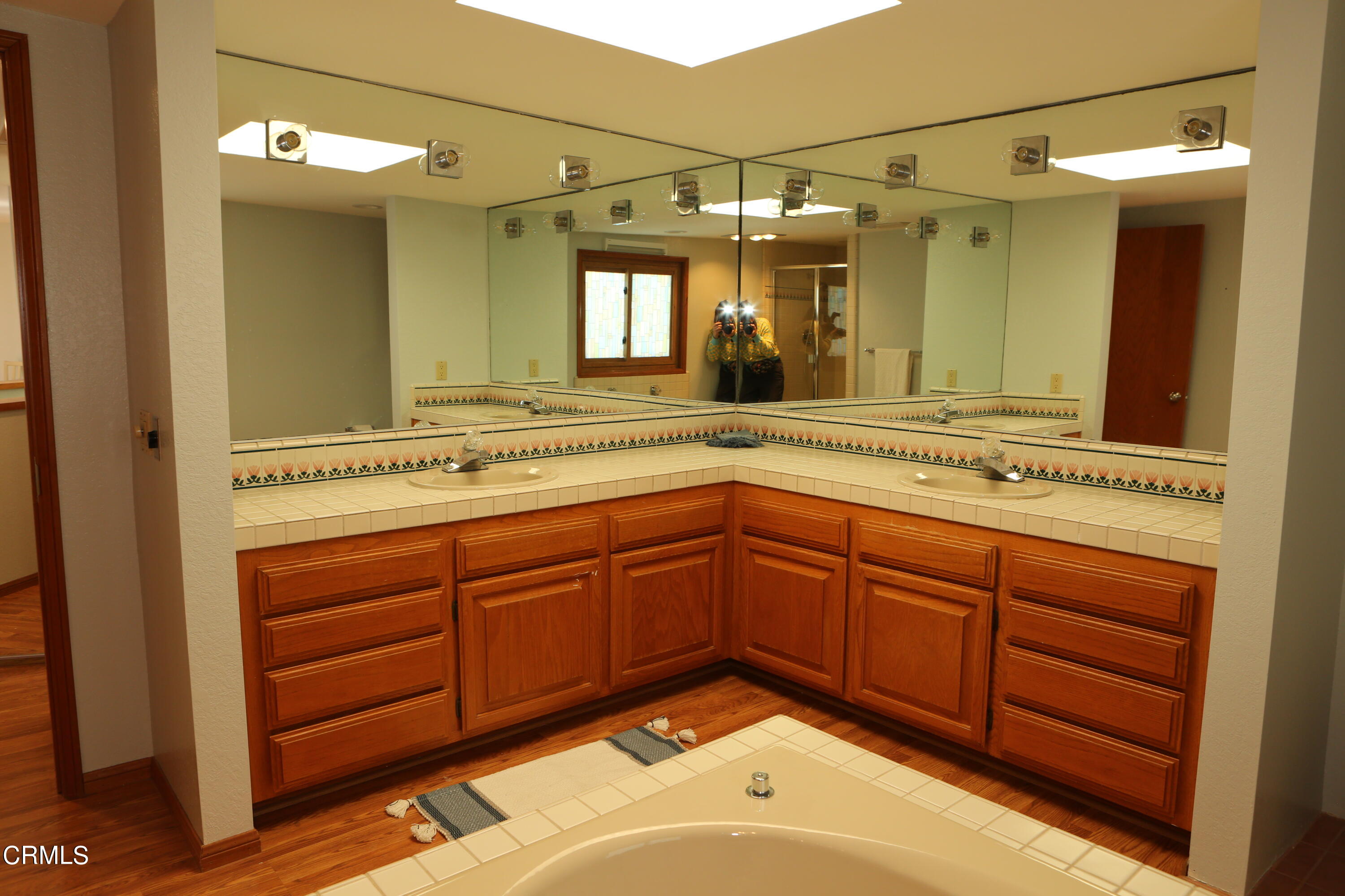 3446 Ocean Drive Oxnard, CA 93035 - Photo 20 of 37 a bathroom with a sink and a mirror