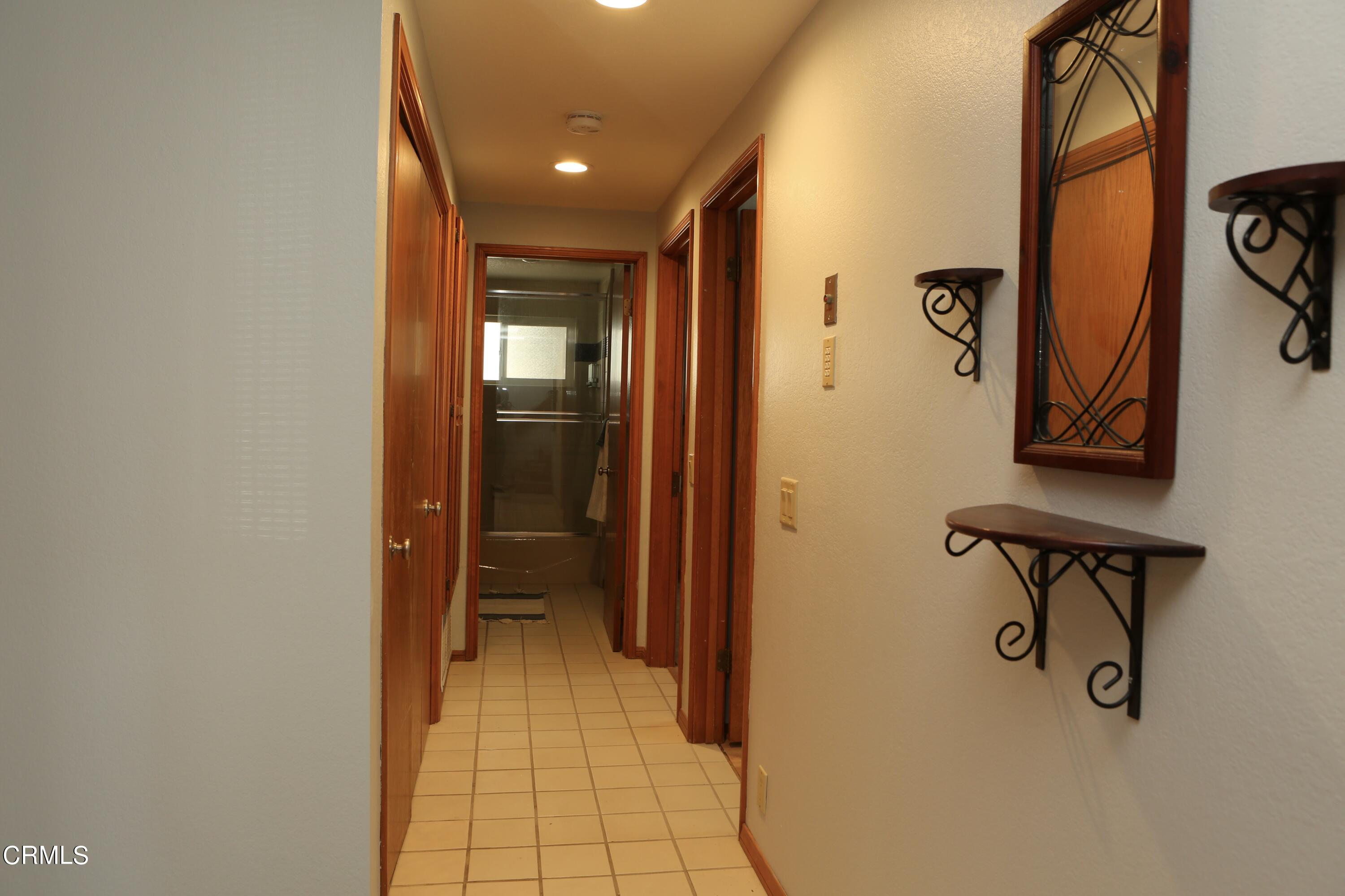 3446 Ocean Drive Oxnard, CA 93035 - Photo 21 of 37 a view of a hallway with wooden floor and closet