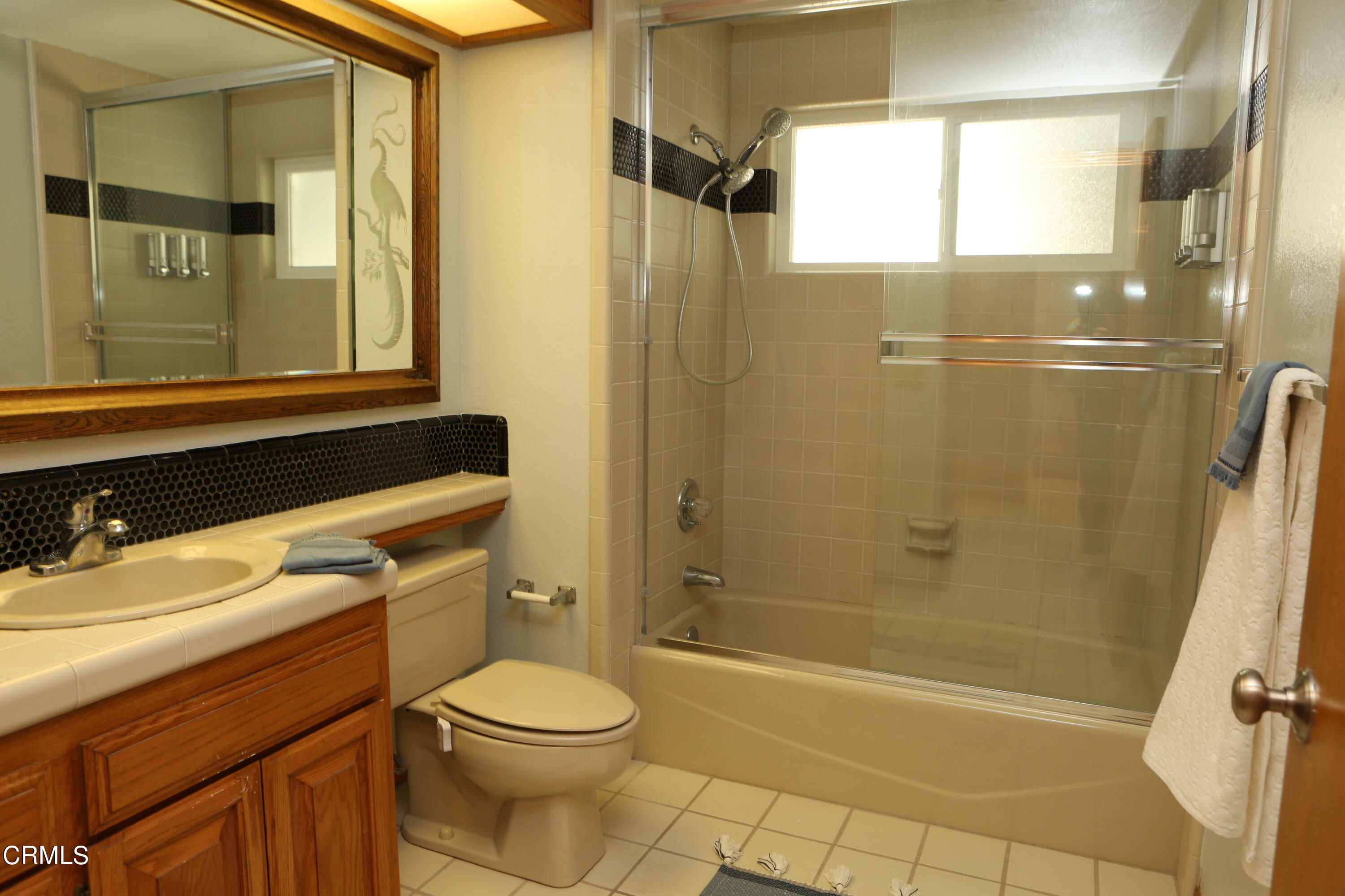 3446 Ocean Drive Oxnard, CA 93035 - Photo 24 of 37 a bathroom with a sink a toilet and shower