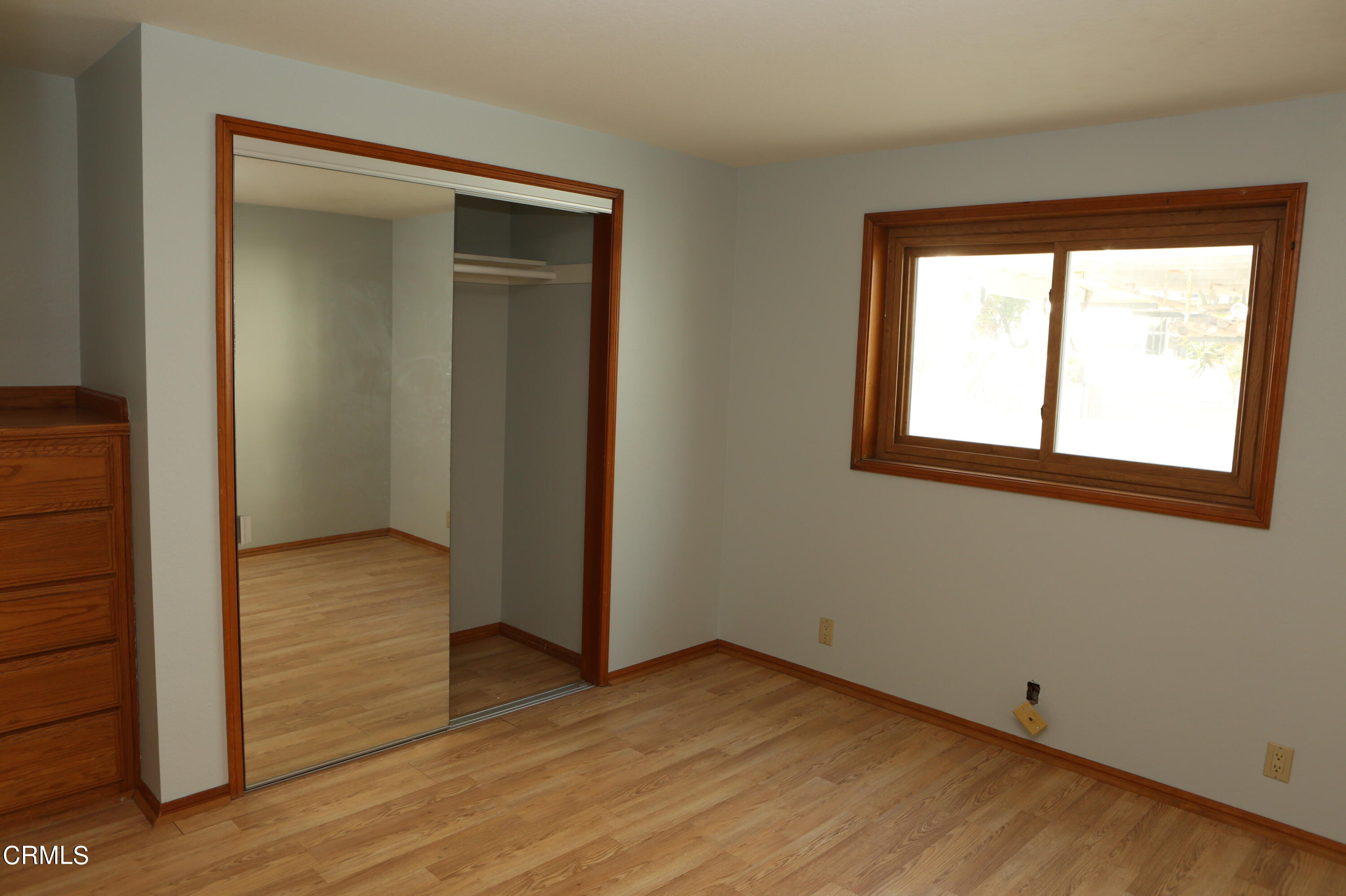 3446 Ocean Drive Oxnard, CA 93035 - Photo 26 of 37 an empty room with wooden floor closet and windows