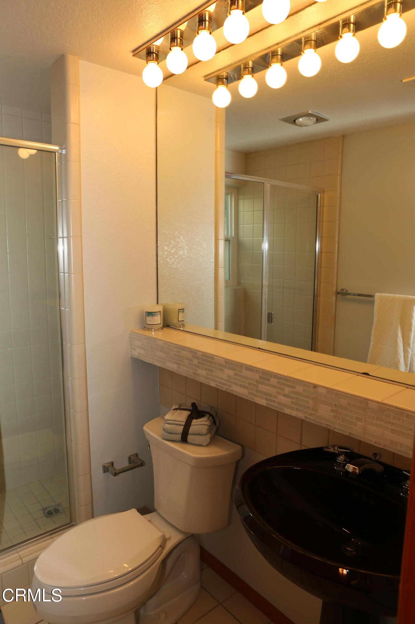 3446 Ocean Drive Oxnard, CA 93035 - Photo 30 of 37 a bathroom with a sink a toilet and shower
