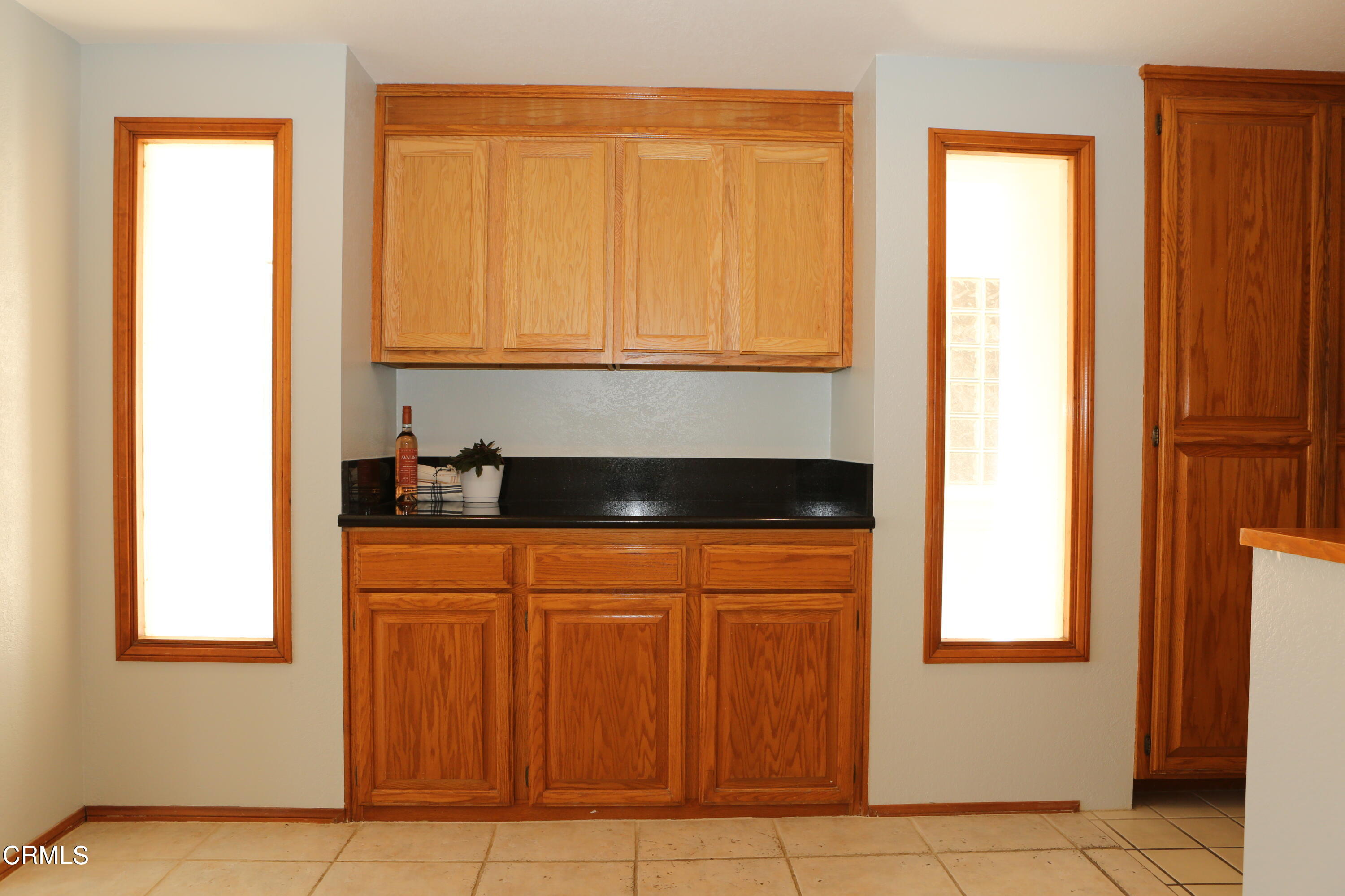 3446 Ocean Drive Oxnard, CA 93035 - Photo 37 of 37 a kitchen with stainless steel appliances granite countertop a refrigerator and a sink