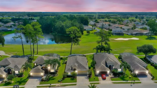 an aerial view of a house with garden space and street view