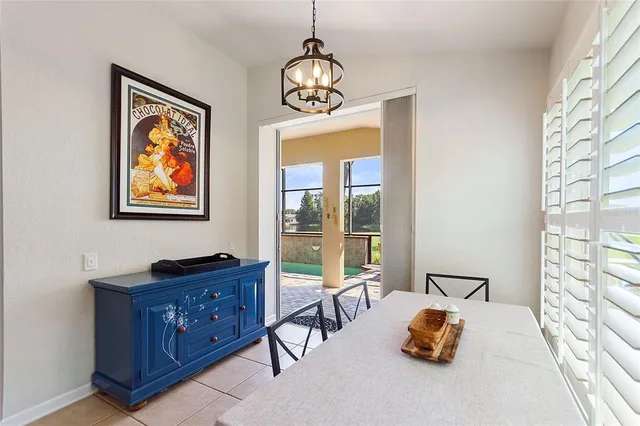 a kitchen with stainless steel appliances kitchen island granite countertop a refrigerator and a stove top oven