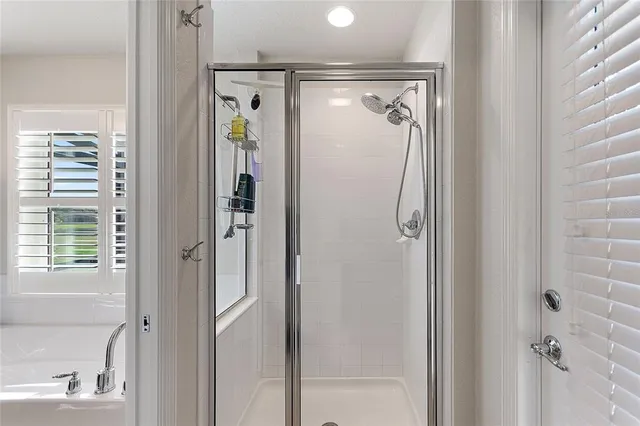 an aerial view of a swimming pool patio and outdoor seating