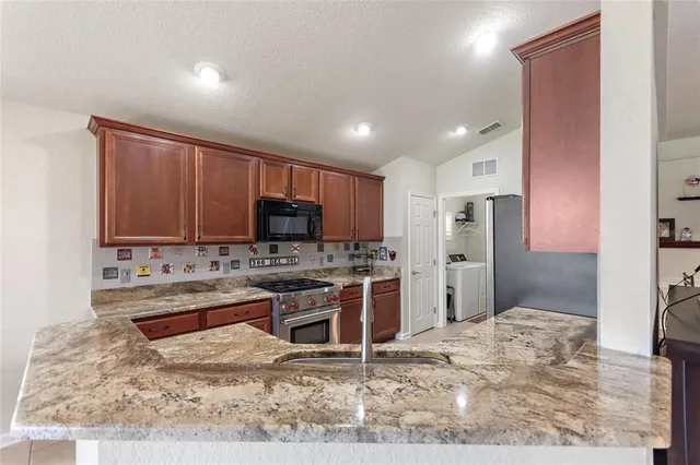 a view of a swimming pool with a patio