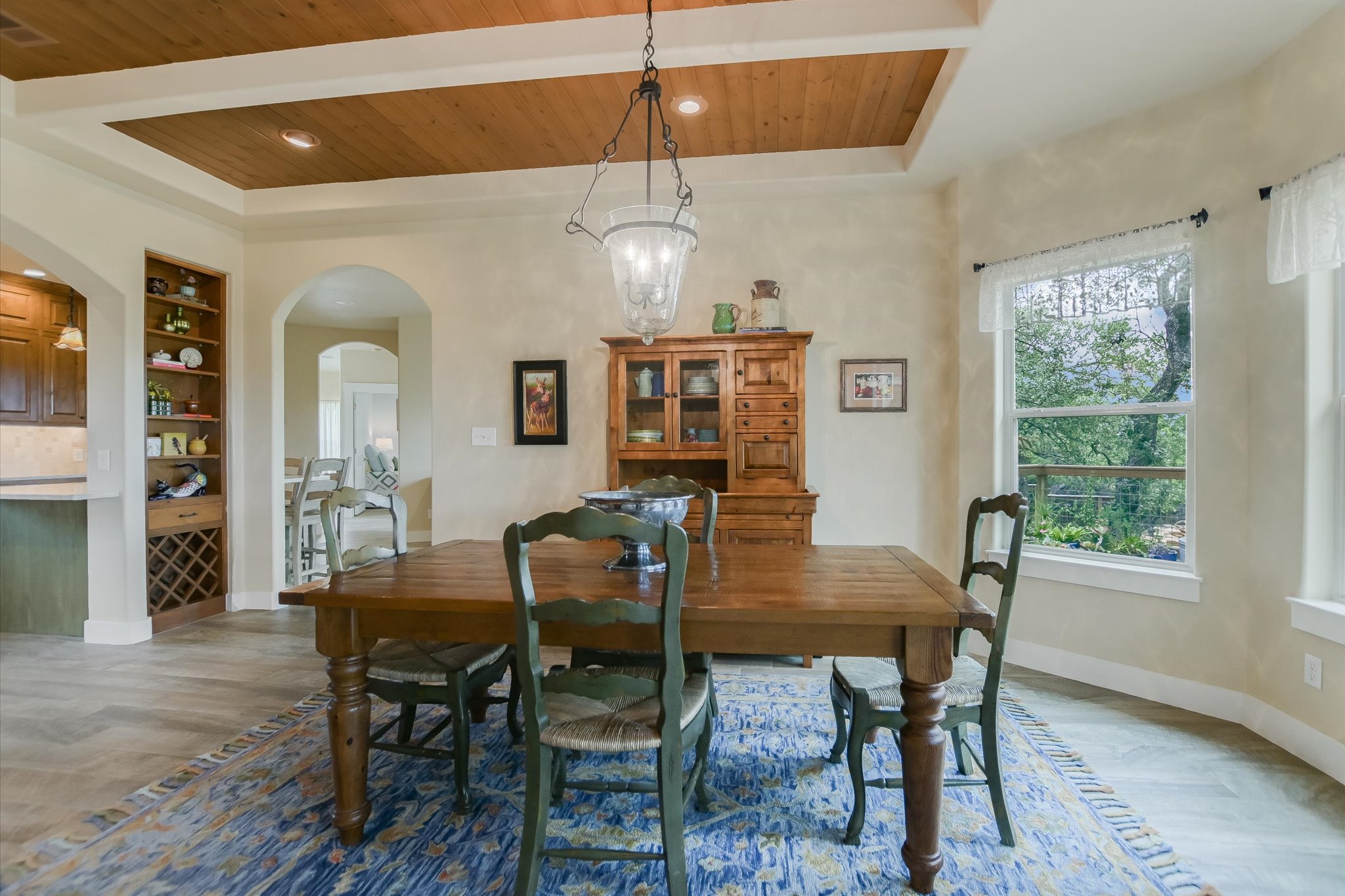 590 Rancho Grande Drive Wimberley, TX 78676 - Photo 10 of 30 a view of a dining room with furniture window and wooden floor