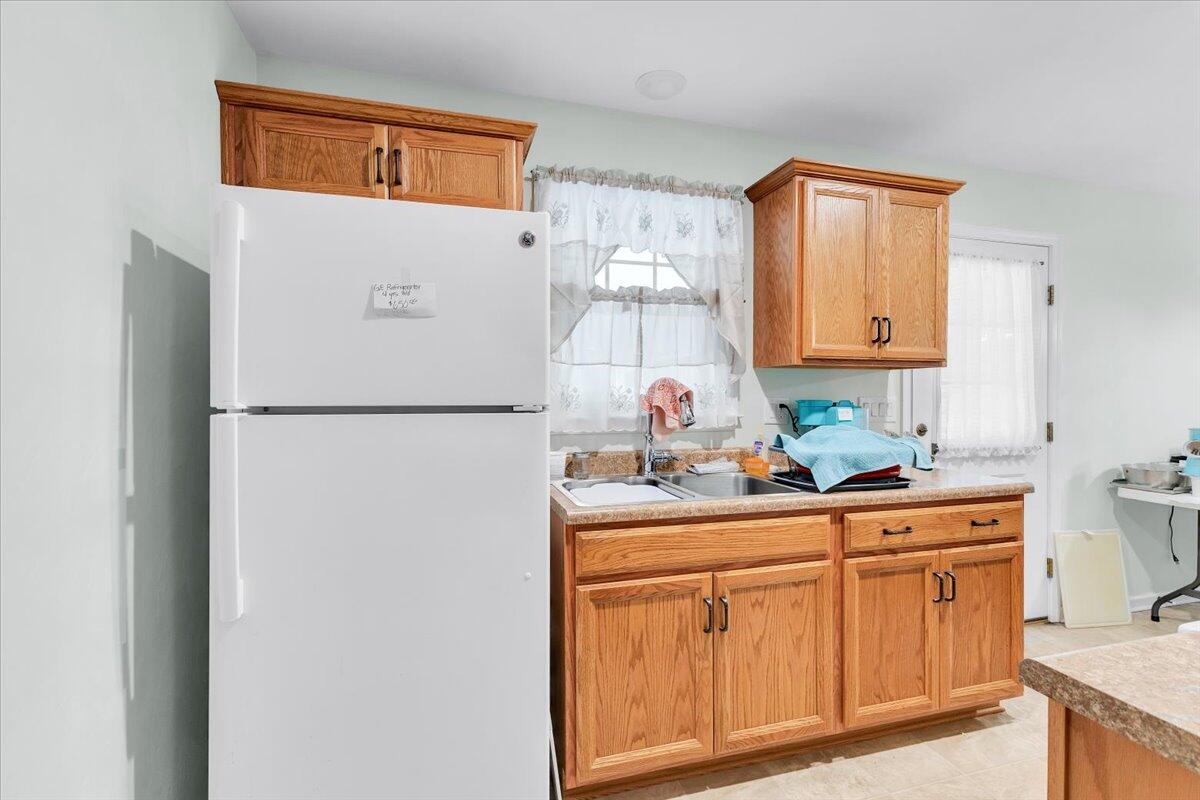 4131 Rutrough Road Southeast Roanoke, VA 24014 - Photo 11 of 42 a kitchen with sink refrigerator and cabinets