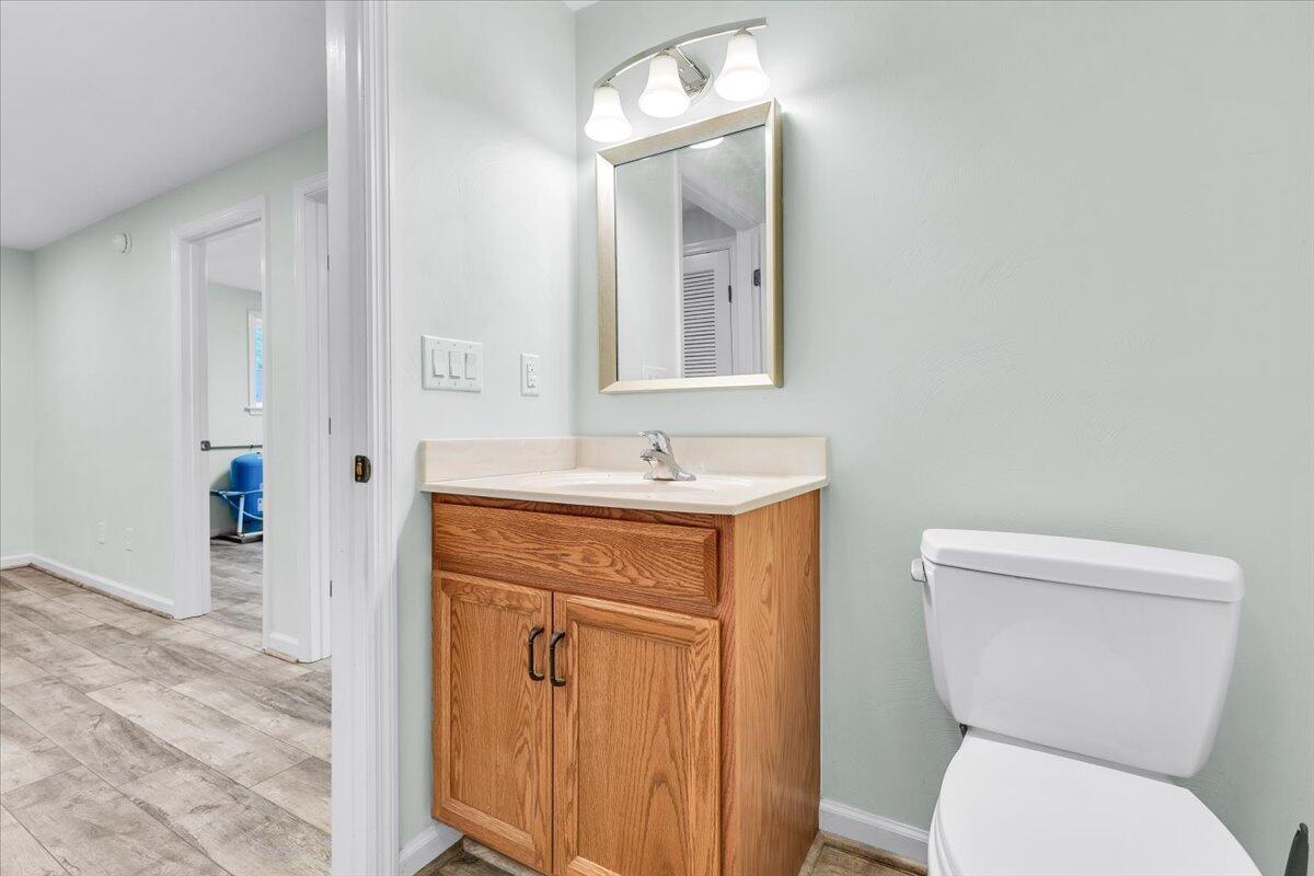 4131 Rutrough Road Southeast Roanoke, VA 24014 - Photo 27 of 42 a bathroom with a toilet sink and mirror
