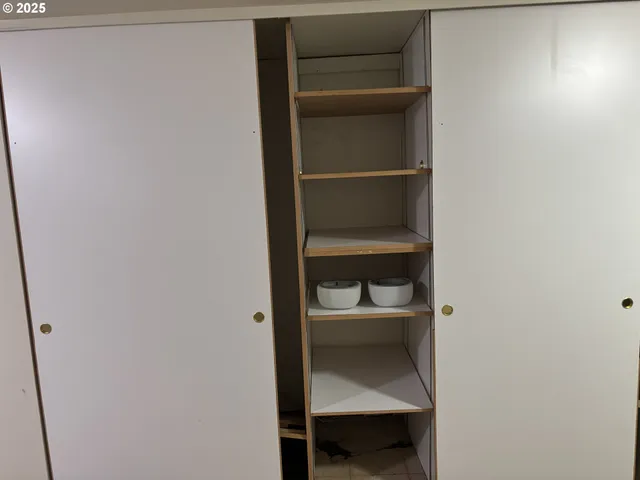 a balcony with wooden floor and fence