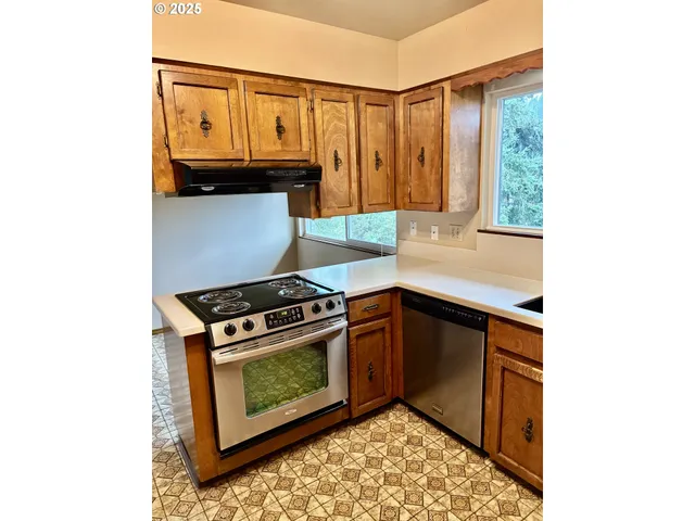 a kitchen with a sink and a window