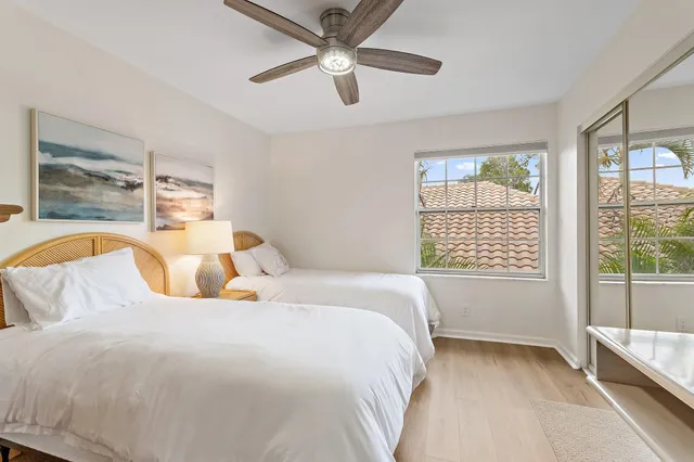 a bedroom with a large bed and a large window