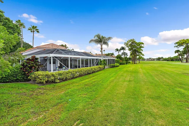 a front view of house with yard and outdoor seating