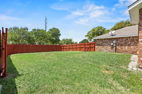 a view of a backyard with a garden and plants