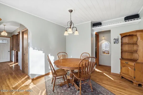 a dining room with furniture and window