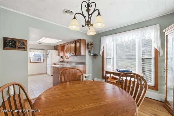 a bedroom with furniture a bed and a chandelier
