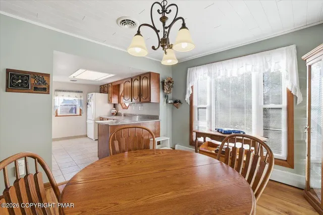 a bedroom with furniture a bed and a chandelier