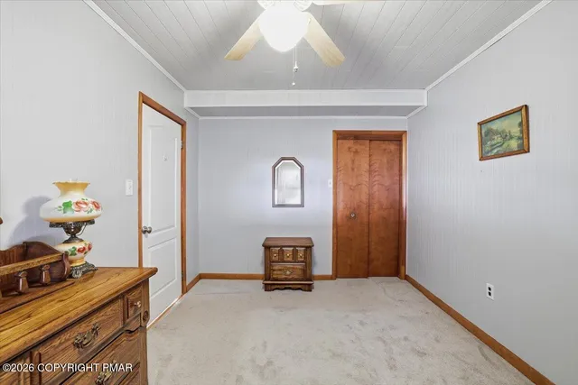 a bathroom with a granite countertop sink mirror toilet and bathtub