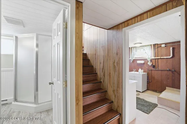 a bathroom with a sink and mirror