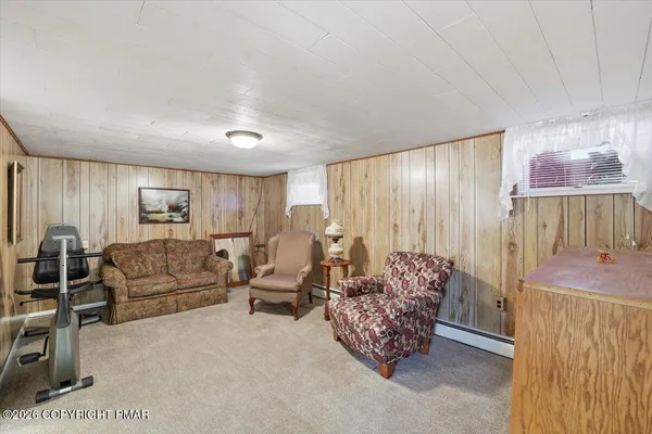 a bedroom with a bed and a chair