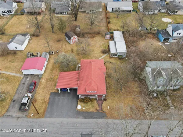 an aerial view of residential houses with outdoor space