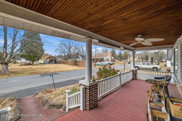 a view of a porch and wooden floor
