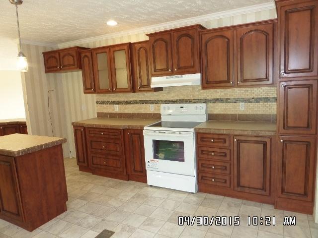 1552 Union School Road Southwest Floyd, VA 24091 - Photo 13 of 40 a kitchen with stainless steel appliances granite countertop a stove sink and cabinets