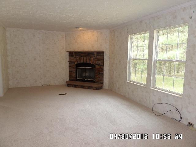 1552 Union School Road Southwest Floyd, VA 24091 - Photo 16 of 40 a view of an empty room with a fireplace and a window