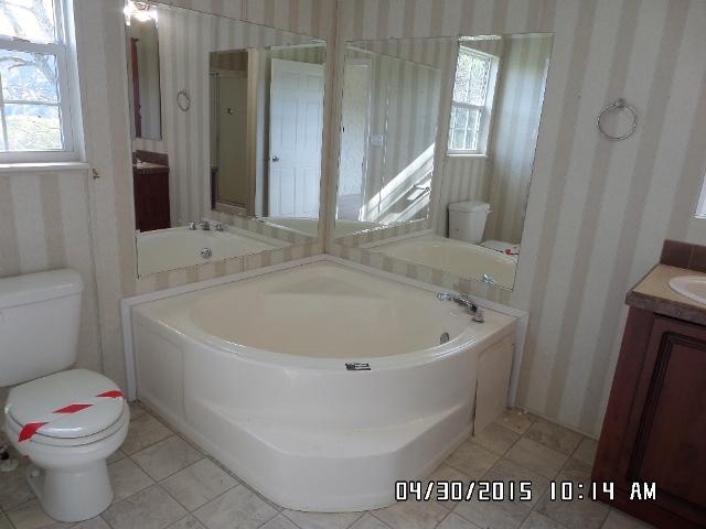 1552 Union School Road Southwest Floyd, VA 24091 - Photo 20 of 40 a white bath tub sitting next to a white toilet