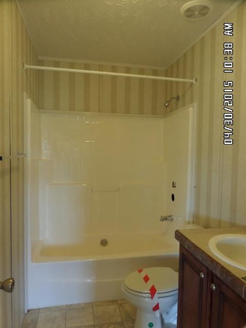 1552 Union School Road Southwest Floyd, VA 24091 - Photo 25 of 40 a bathroom with a granite countertop bathtub shower