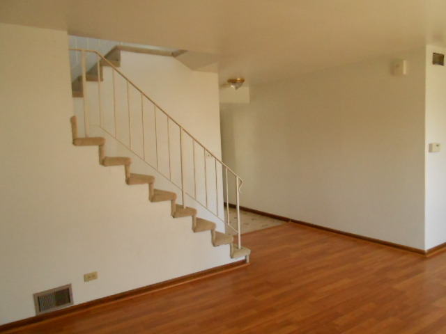 2023 Raleigh Place Hoffman Estates, IL 60169 - Photo 3 of 10 a view of entryway and hall with wooden floor